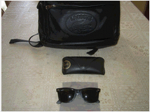 zaino-lacoste-in-pelle-neroocchiali-sole-ray-ban 